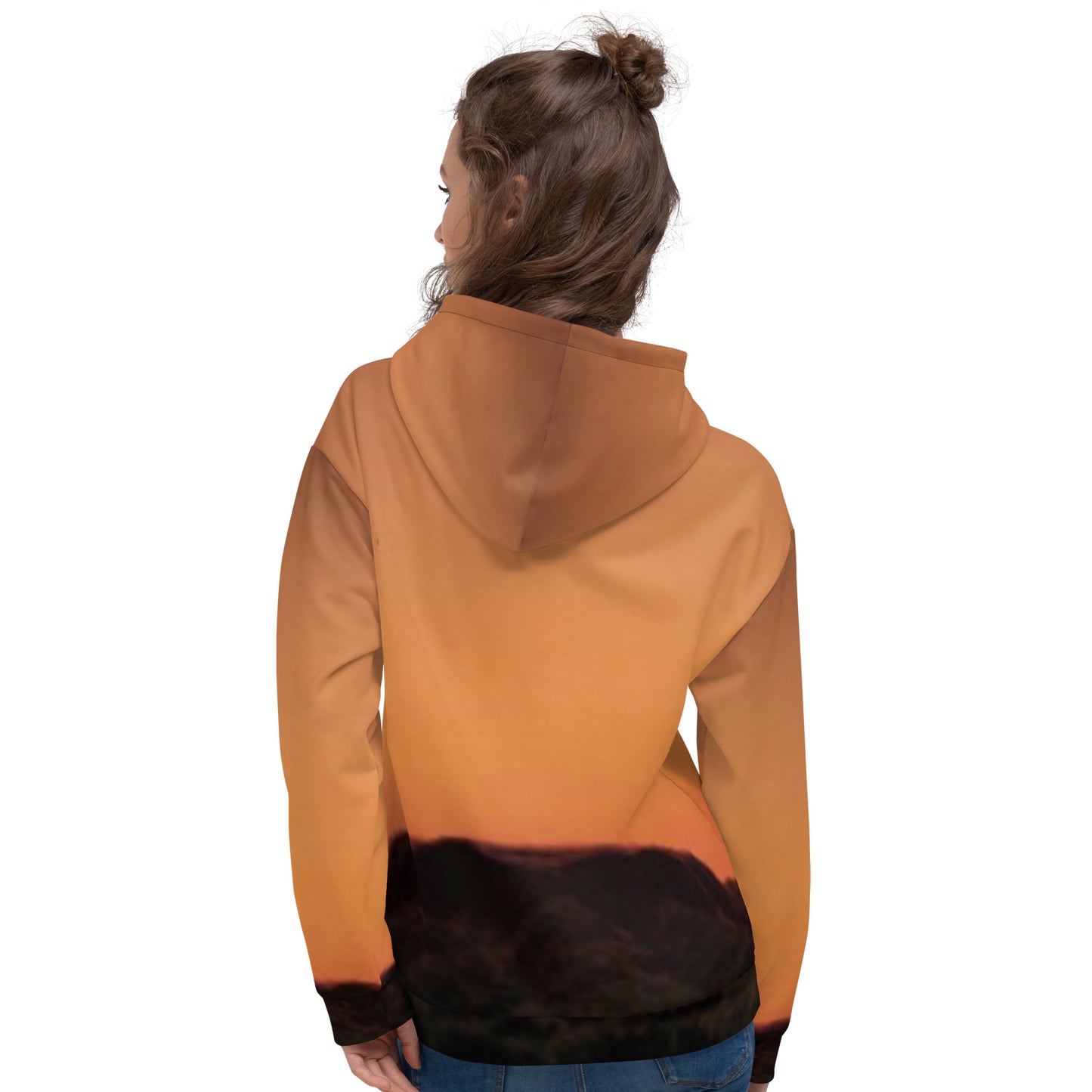 Back view of woman wearing kallistii Mesa Hoodie sunset design with orange and black gradient hooded sweatshirt