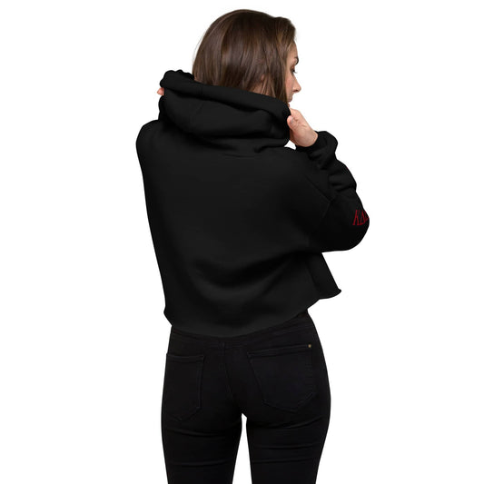 Back view of woman wearing black womens fashion crop hoodie by kallistii with hood up and long sleeves