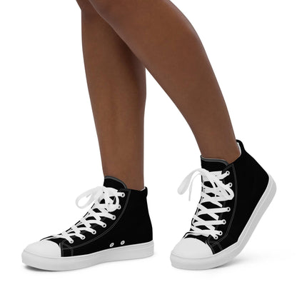 Kallistii black high-top shoes for women with white laces and rubber soles on model's feet