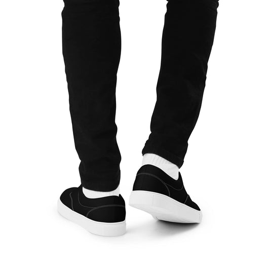 Kallistii stylish low top shoes for men in black with white soles worn with black pants