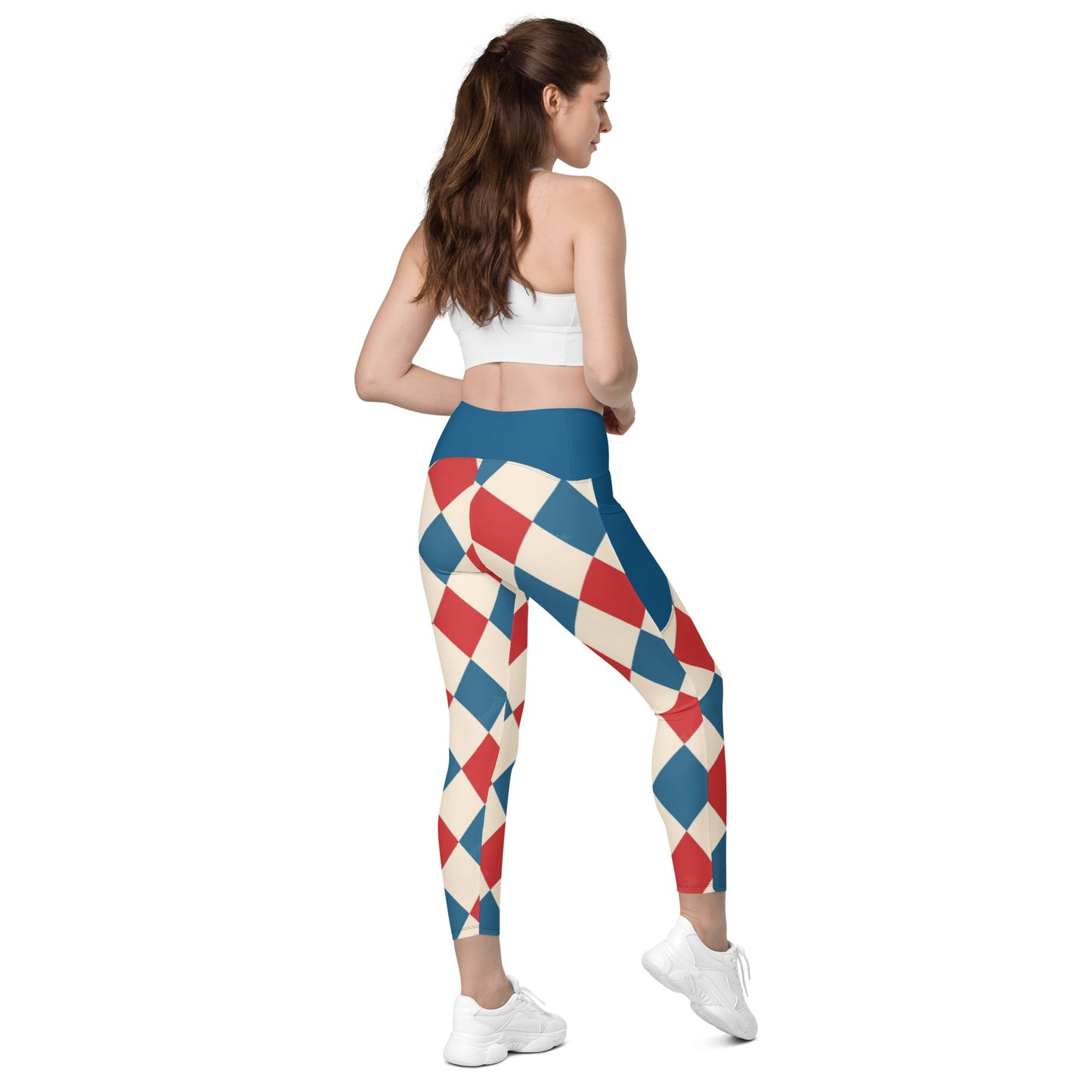 Kallistii harlequin leggings with red blue and cream diamond pattern worn with white crop top and white sneakers