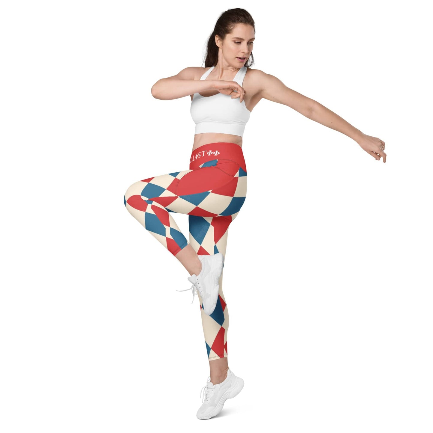 Kallistii harlequin leggings in red white and blue worn by woman in a white sports bra and white sneakers