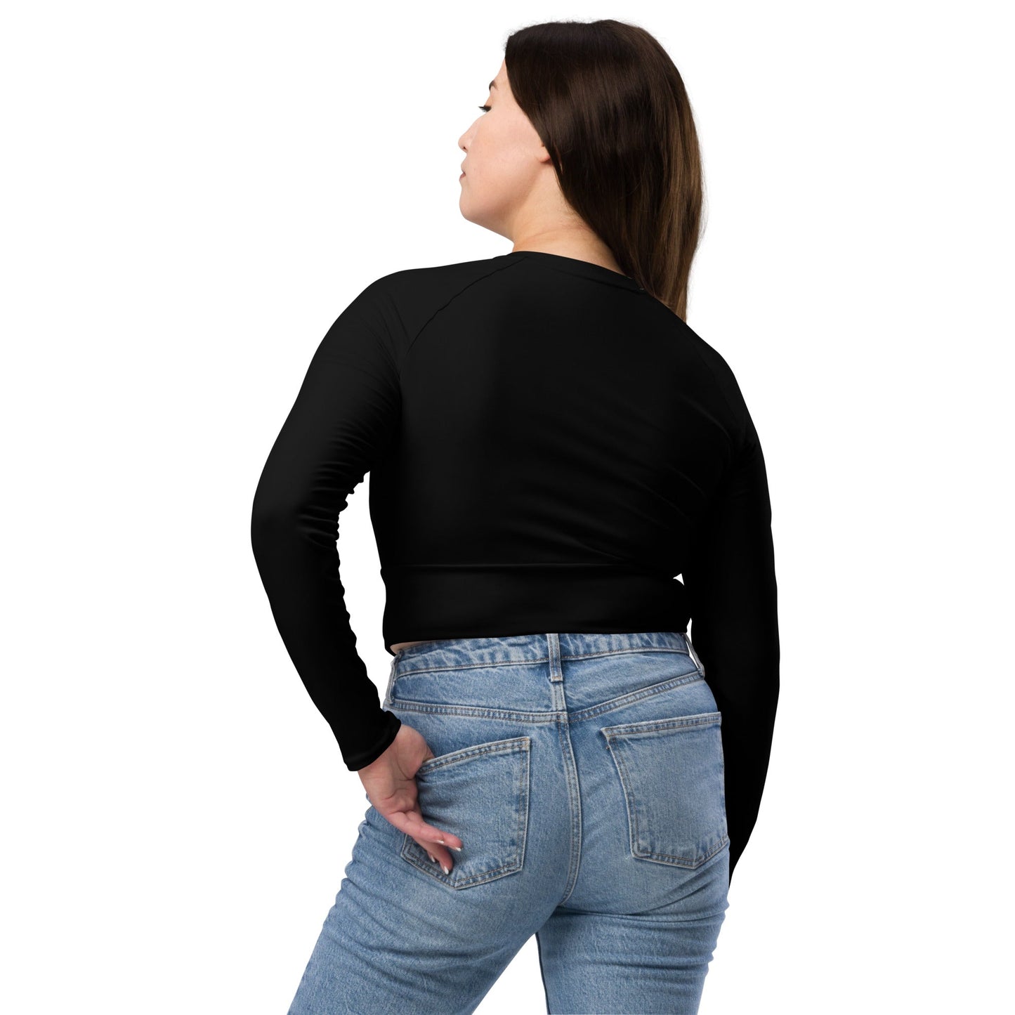 Back view of a woman wearing a black long sleeve unique womens workout crop top and blue jeans