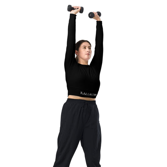 Woman wearing a unique womens workout crop top by kallistii lifting dumbbells overhead