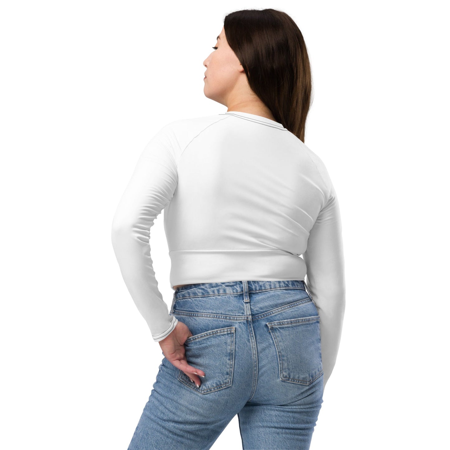 Back view of woman wearing a white unique womens workout crop top paired with blue jeans