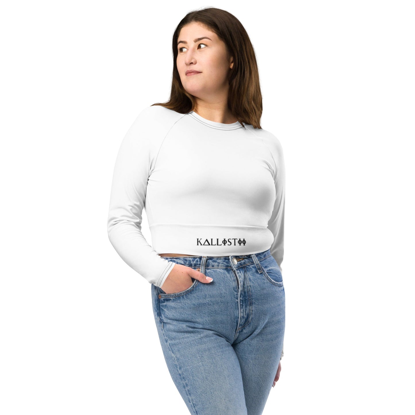 White long sleeve unique womens workout crop top by kallistii paired with blue jeans
