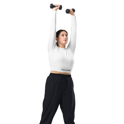 Woman wearing kallistii unique womens workout crop top in white lifting dumbbells overhead