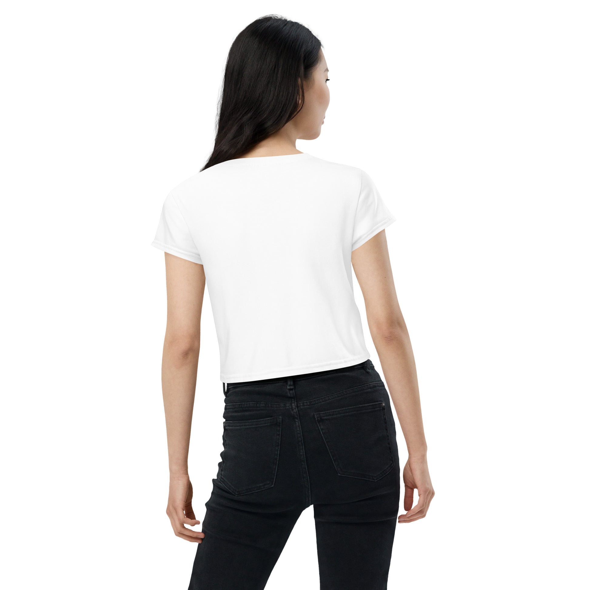 Back view of woman wearing white dragon constellation crop tee paired with black jeans