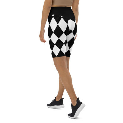 Woman wearing black and white harlequin active shorts by kallistii in a diamond pattern