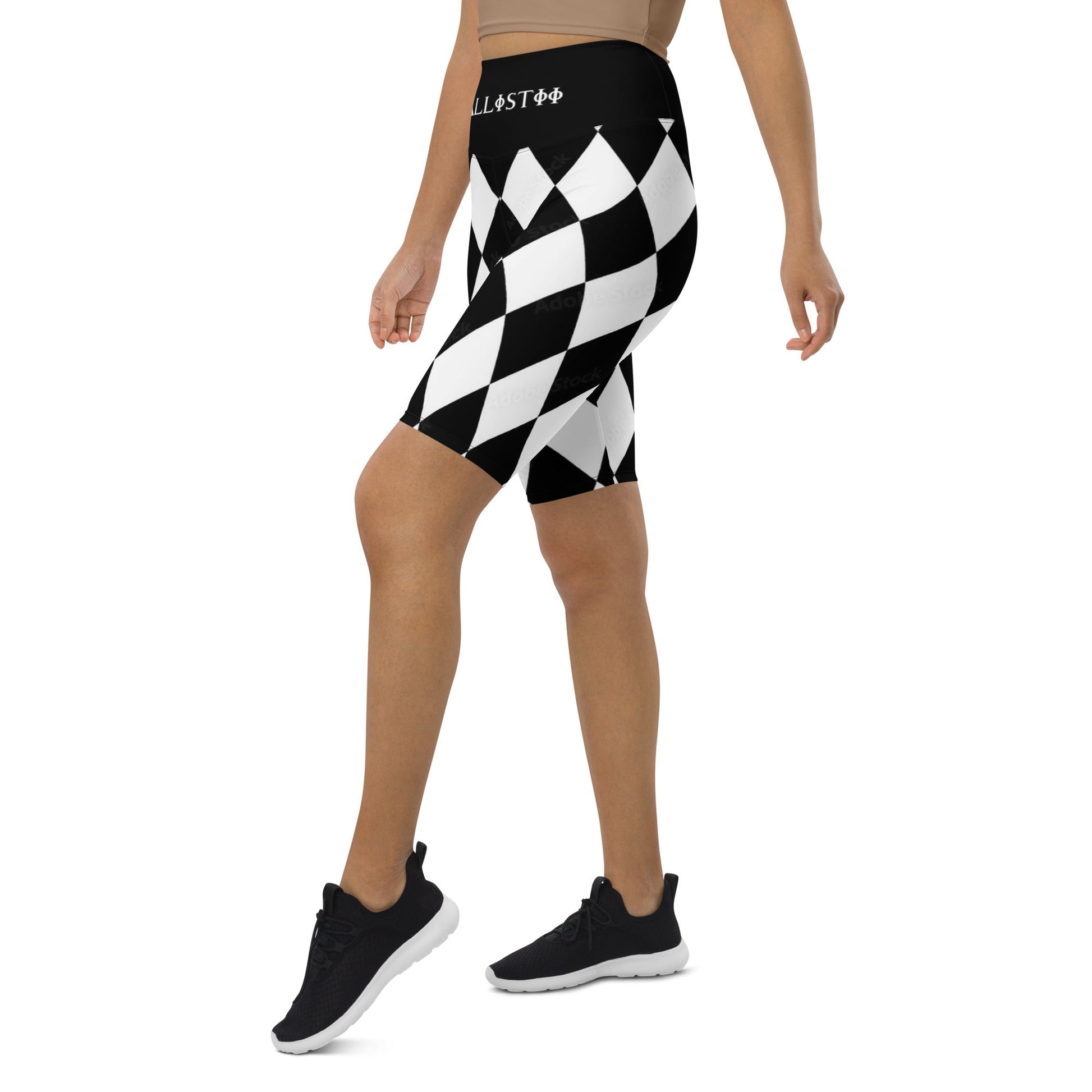Kallistii harlequin active shorts in black and white diamond pattern worn with black sneakers