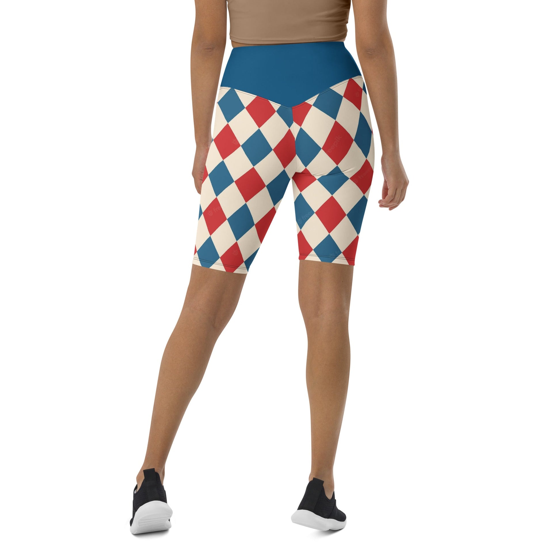 Back view of kallistii harlequin active shorts with blue, red, and cream diamond pattern