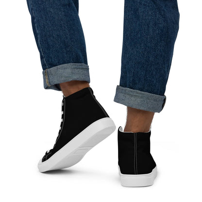 Black high-top statement sneakers for men worn with rolled-up denim jeans showing white soles and stitching details