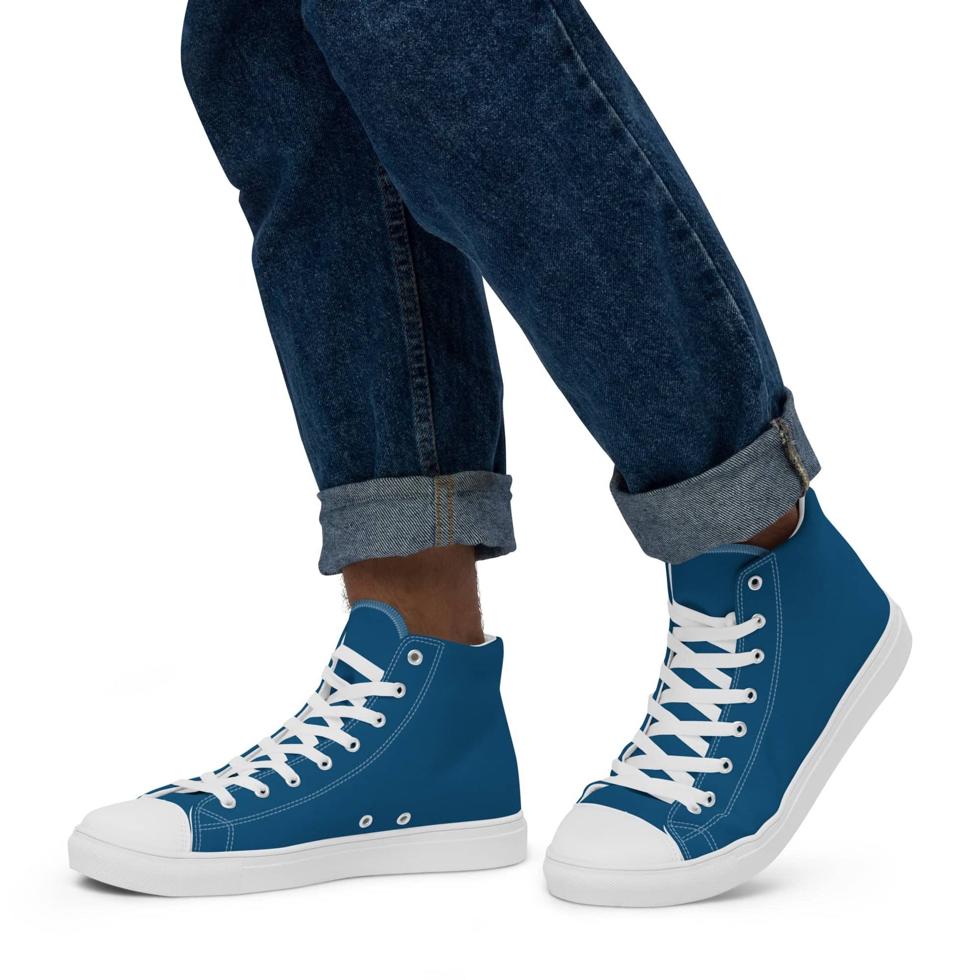 Kallistii blue high-top statement sneakers for men paired with rolled-up dark jeans