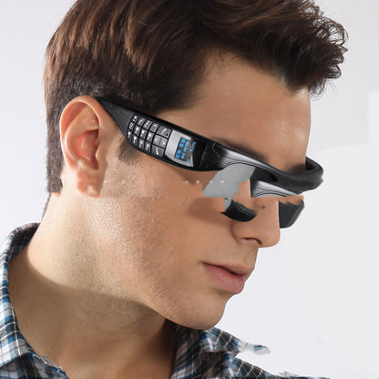 Kallistii smart glasses with phone and camera in black worn by man showing built-in keypad and display
