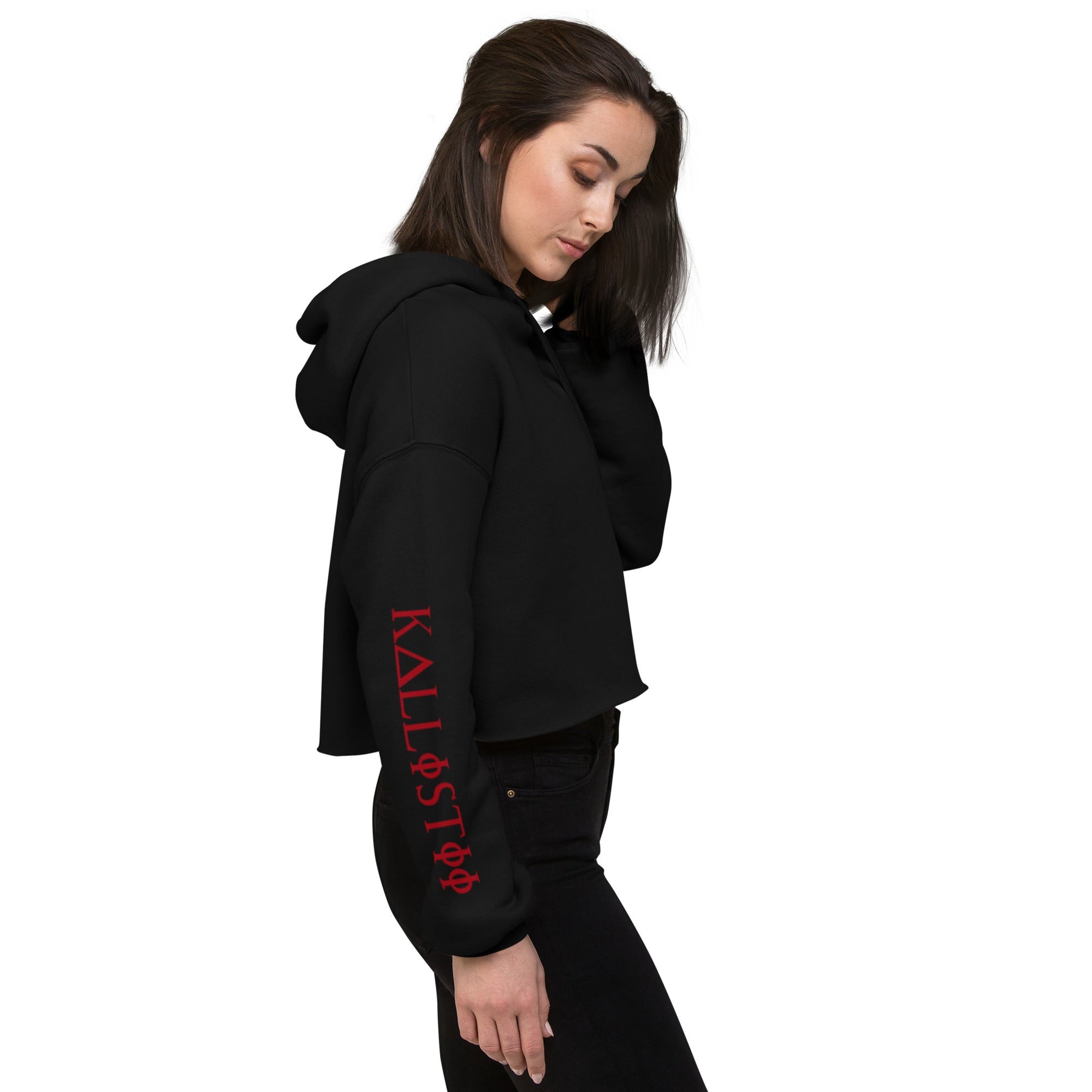 Woman wearing a black kallistii womens fashion crop hoodie with red logo on sleeve and hood