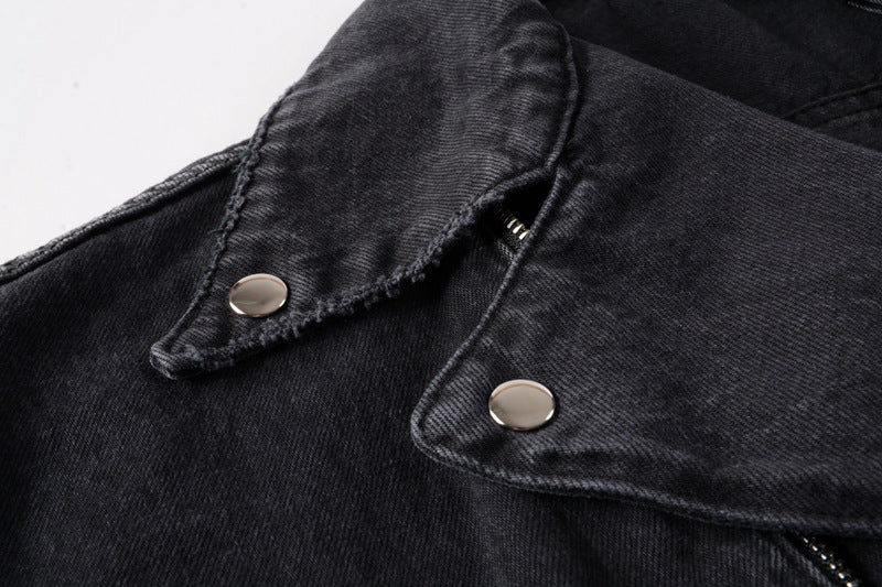 Close-up of kallistii black denim motorcycle jacket collar with metal snap buttons