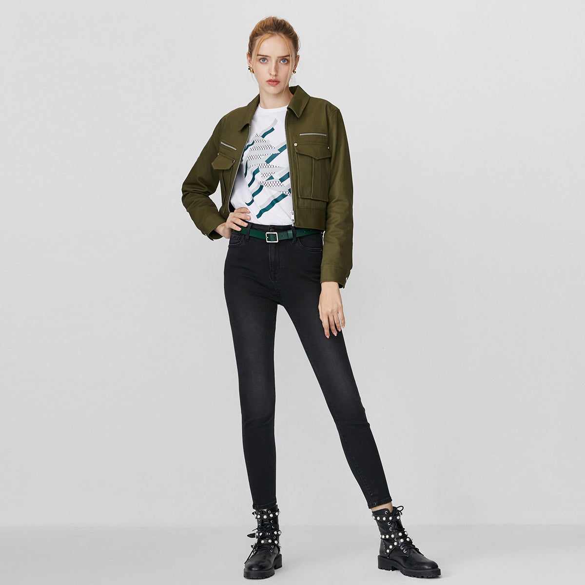 Kallistii black fade skinny jeans worn with green jacket and graphic white t-shirt