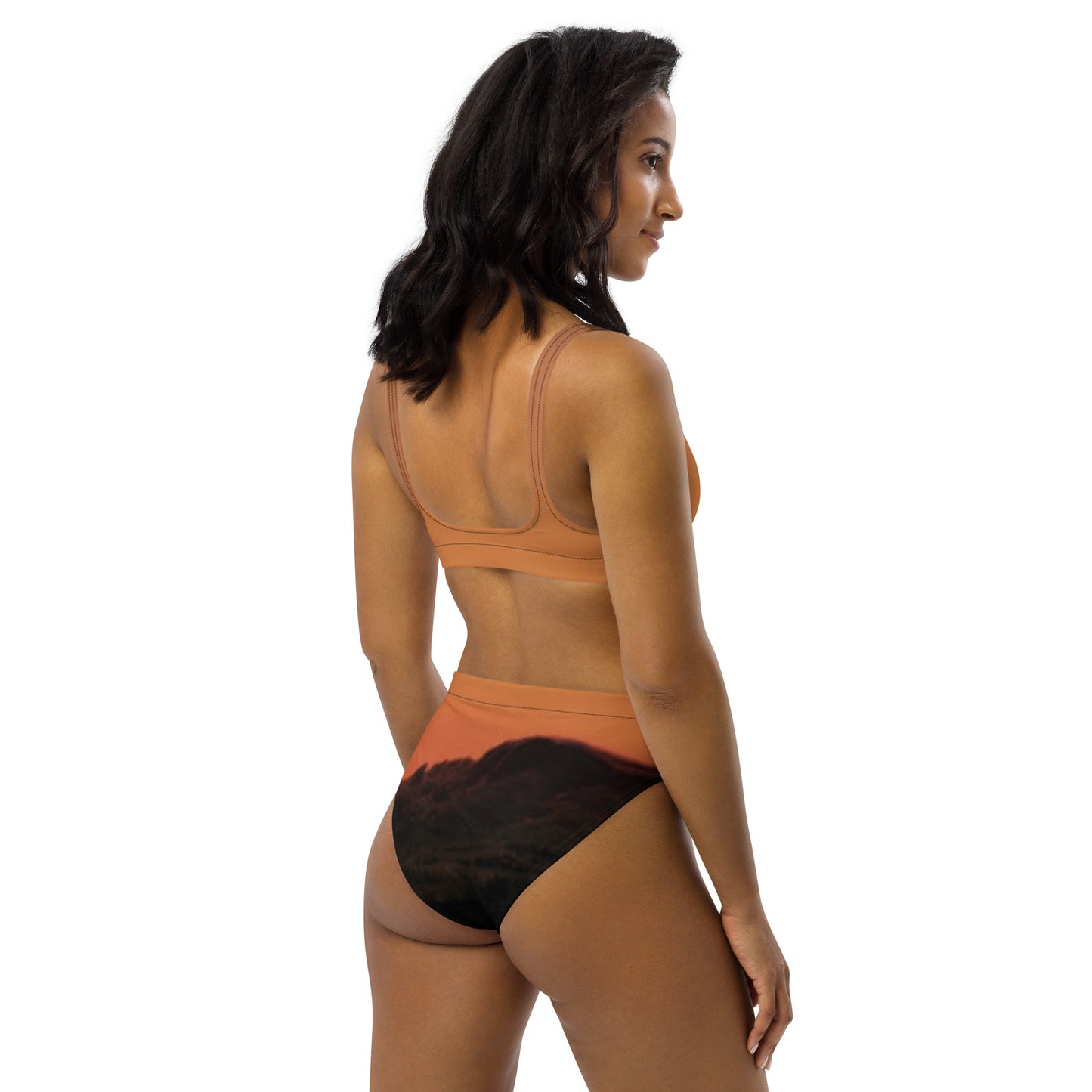 Woman wearing Mesa bikini set unique design in earthy tones with mountain landscape print on bottoms