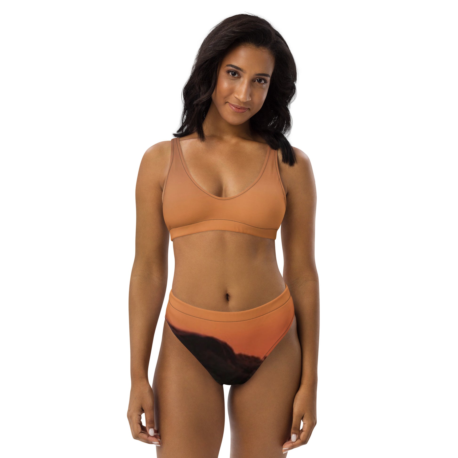 Kallistii Mesa bikini set unique design with a warm orange top and artistic black and orange bottom