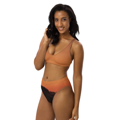 Woman wearing kallistii Mesa bikini set unique design in orange with black high-waisted bottoms