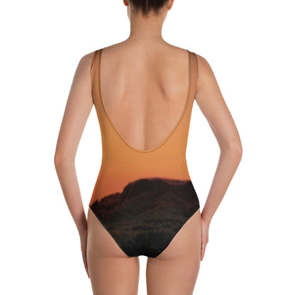 Back view of Mesa swimsuit for women featuring a sunset mountain design and low scoop back