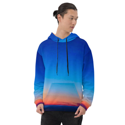 Kallistii skyline hoodie unisex with blue and orange gradient sunset design worn by a male model