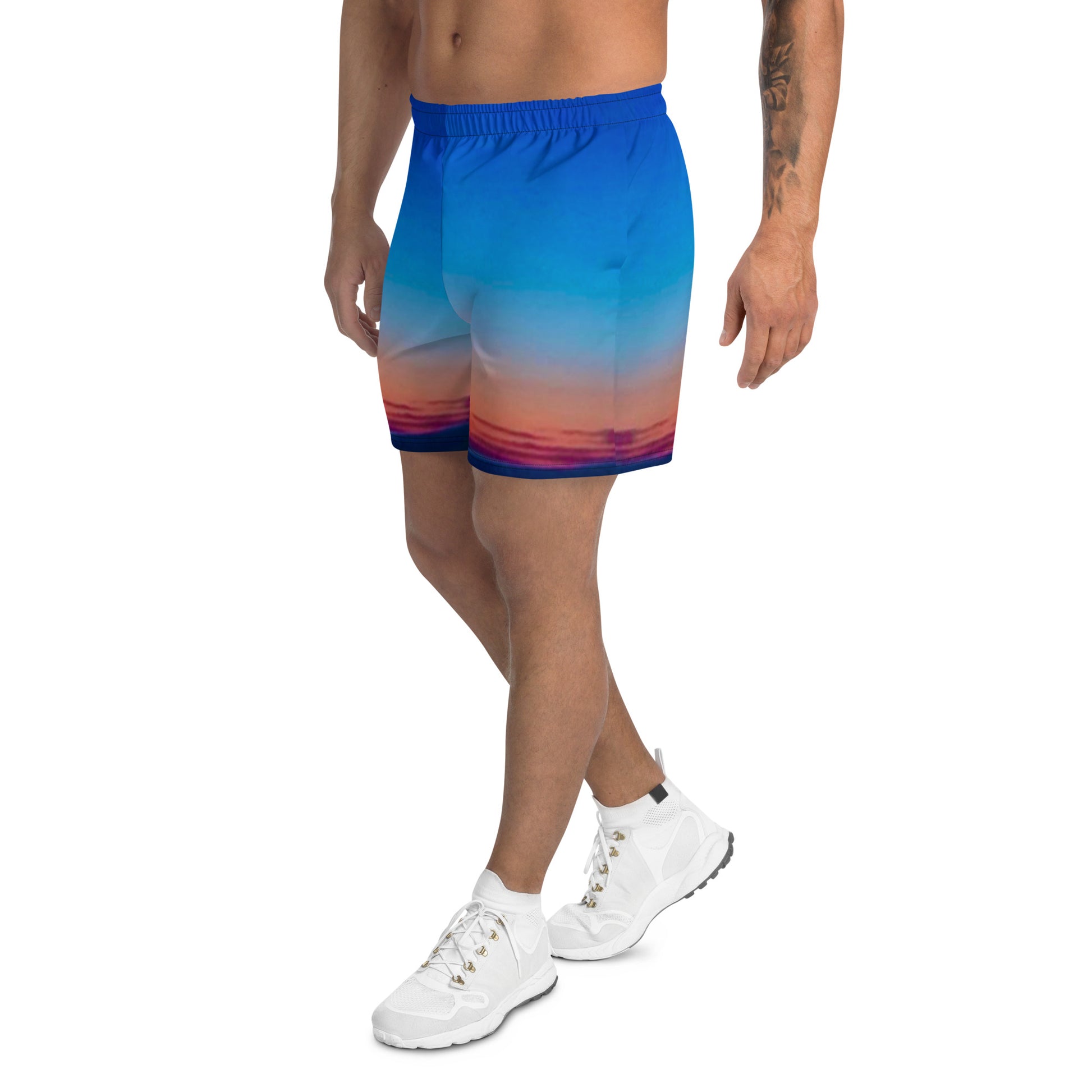 Kallistii skyline mens athletic shorts with blue and sunset gradient design worn with white sneakers
