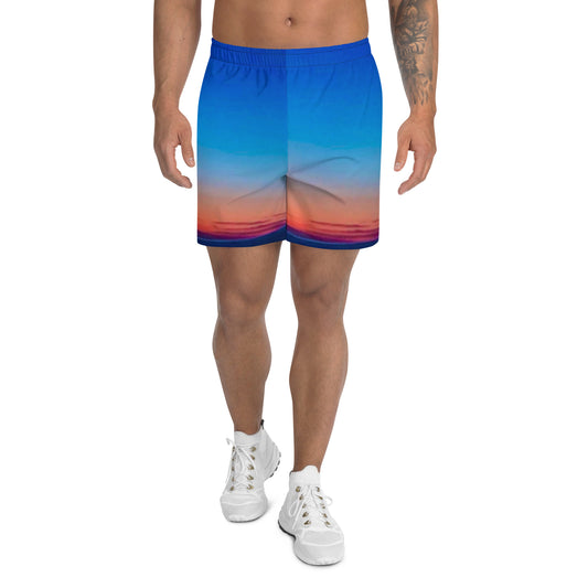 kallistii skyline mens athletic shorts with blue and orange gradient design worn with white sneakers