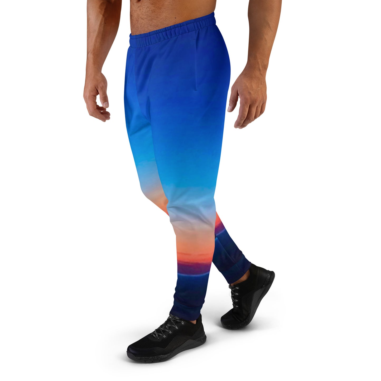 Kallistii skyline mens joggers with blue gradient and sunset cityscape design worn with black sneakers