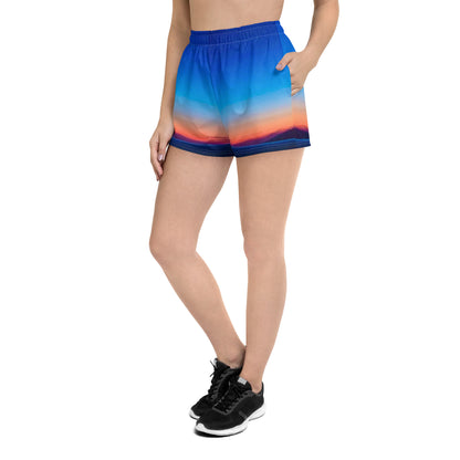 Kallistii skyline print running shorts with elastic waist and side pockets worn with black running shoes