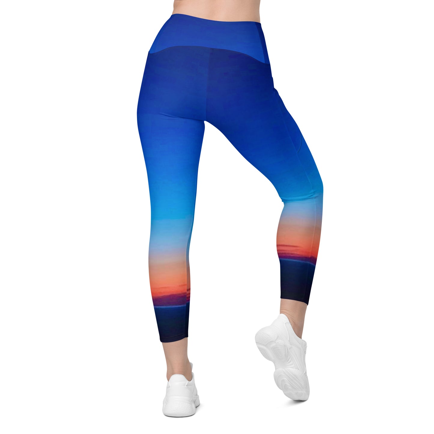 Kallistii skyline print womens leggings featuring a vibrant blue and sunset color gradient design