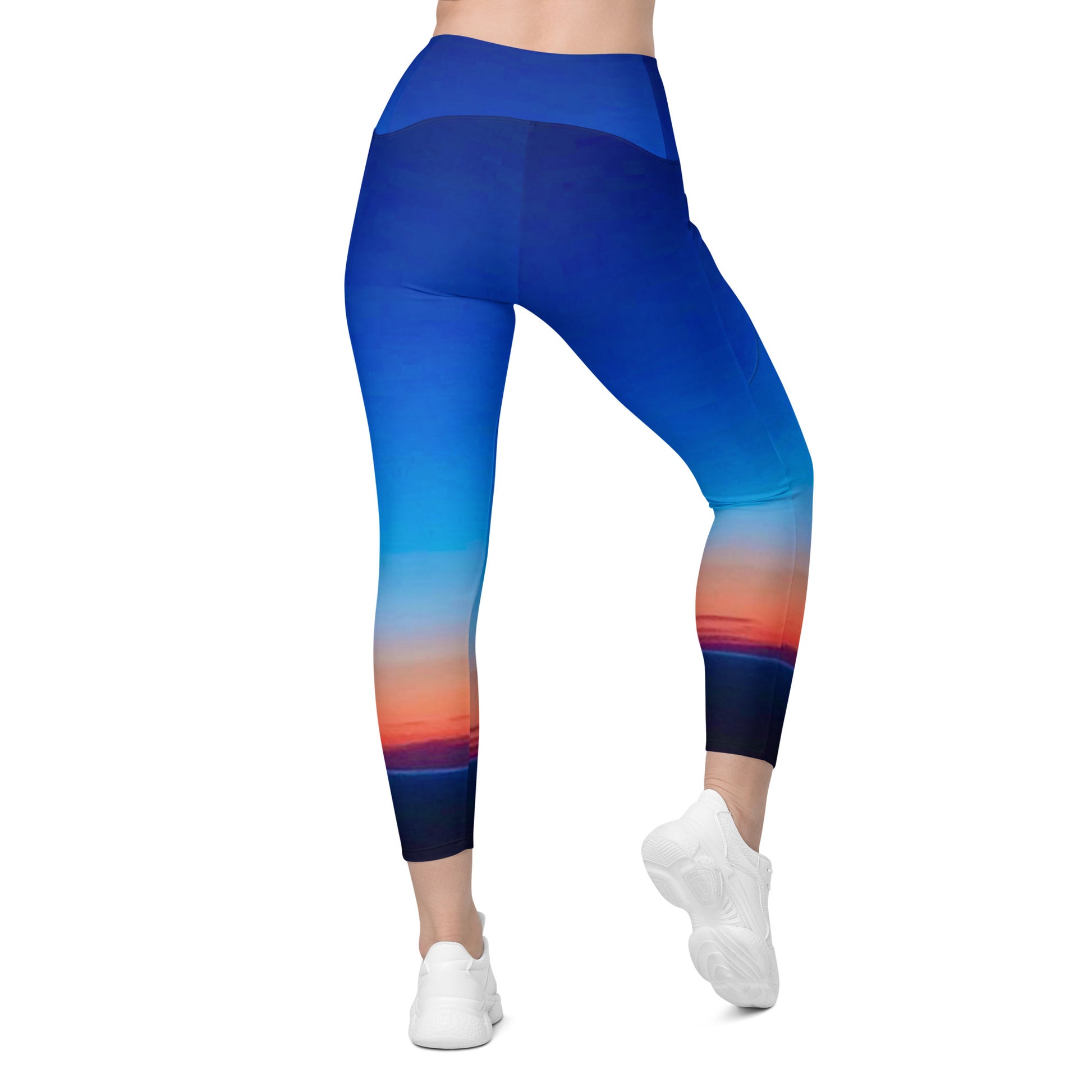 Kallistii skyline print womens leggings featuring a vibrant blue and sunset color gradient design