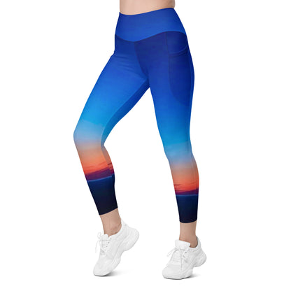 Kallistii skyline print womens leggings in blue with a sunset cityscape design and side pocket