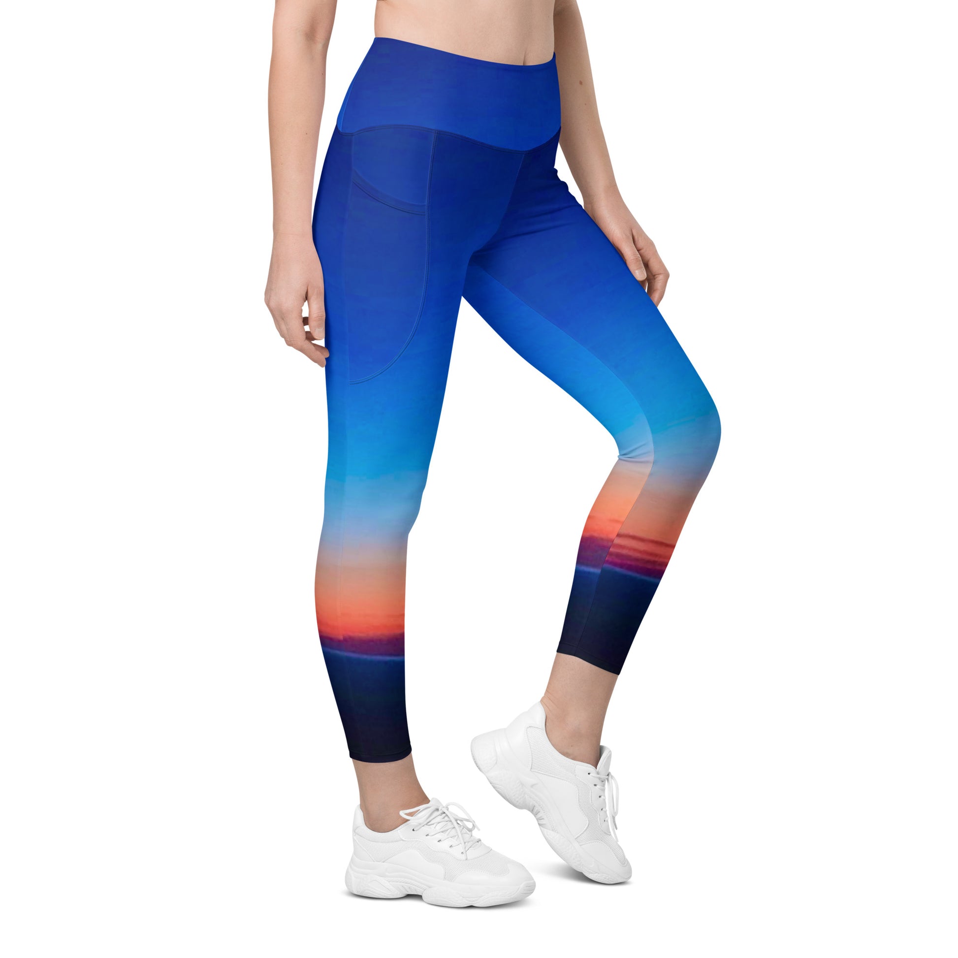 Kallistii skyline print womens leggings featuring a blue sunset cityscape design with side pockets