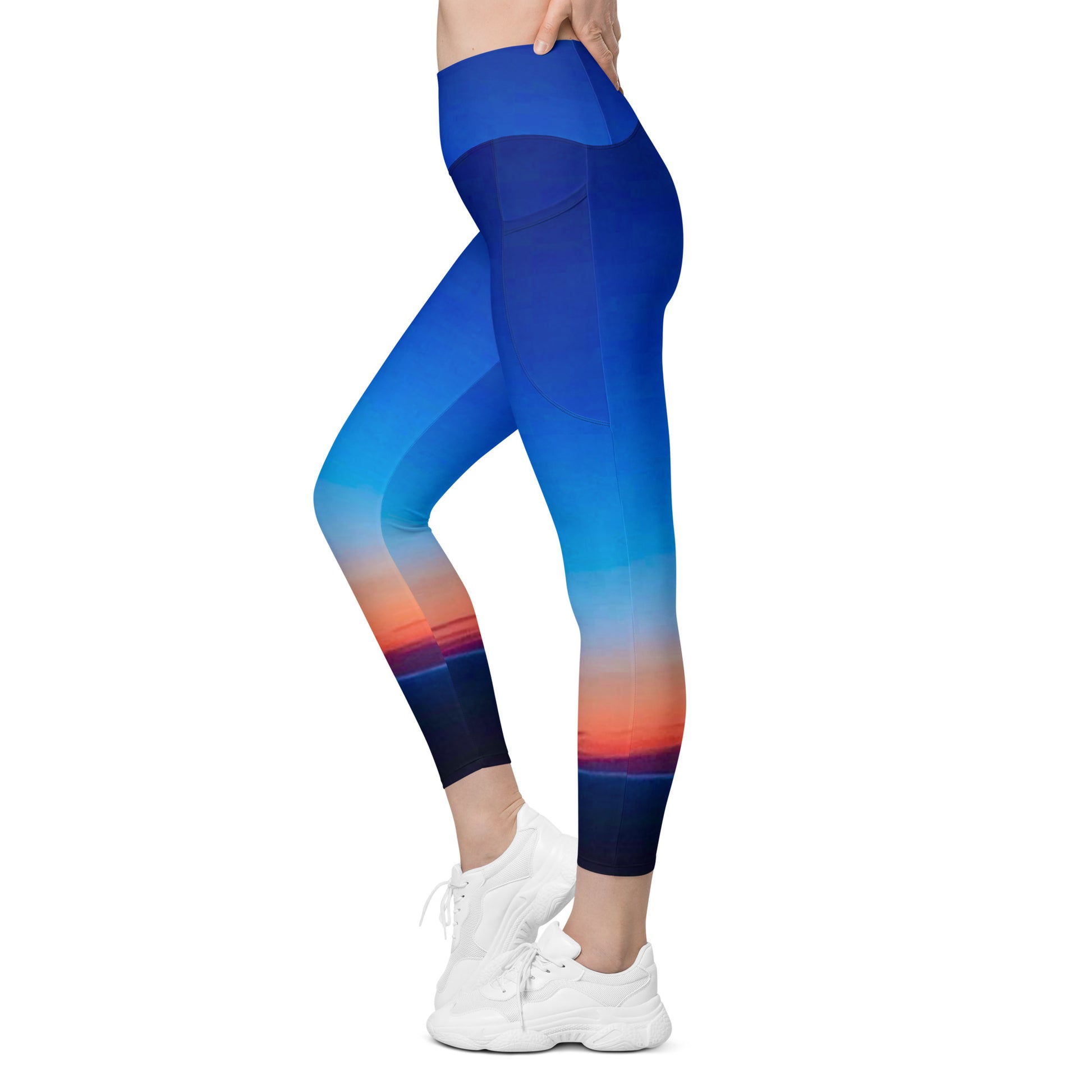 Kallistii skyline print womens leggings in blue with sunset cityscape design and side pockets