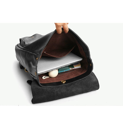 Stylish black leather backpack open showing spacious interior with laptop and accessories